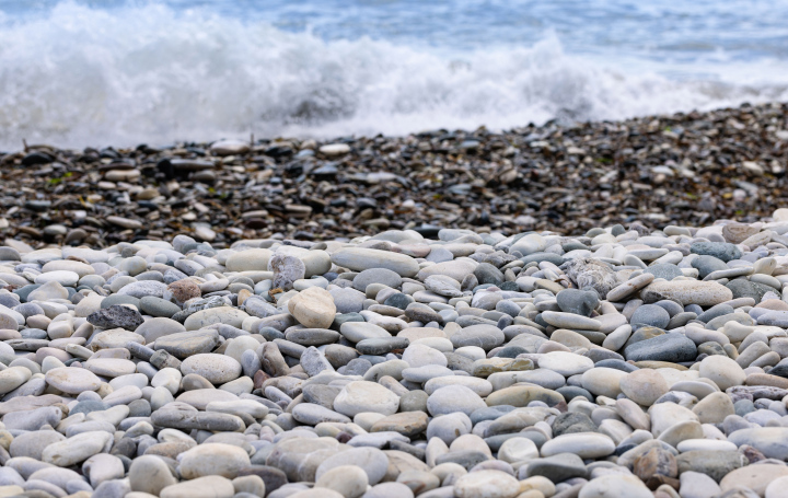 Stones on the beach and sea waves