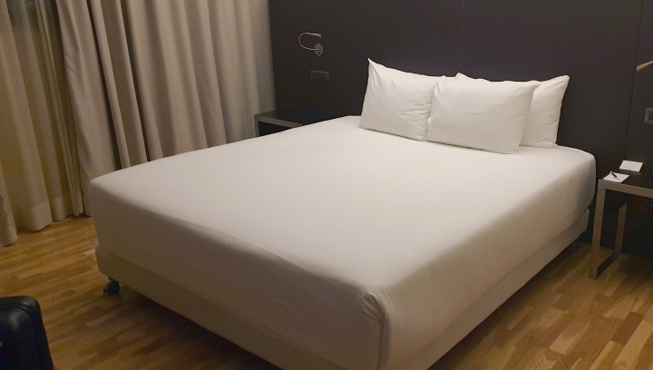 A bed in a hotel room