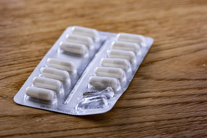 White capsules, tablets