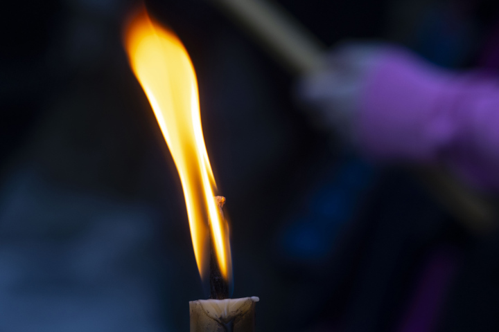 The narrow candle flame