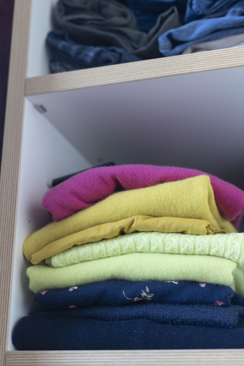 Clothes on a shelf in the closet