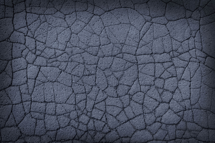 Cracked surface, dark background