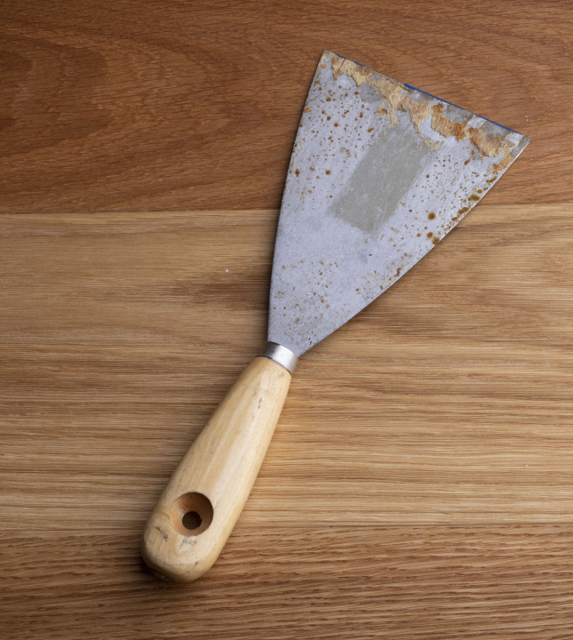 Spatula on a wooden background