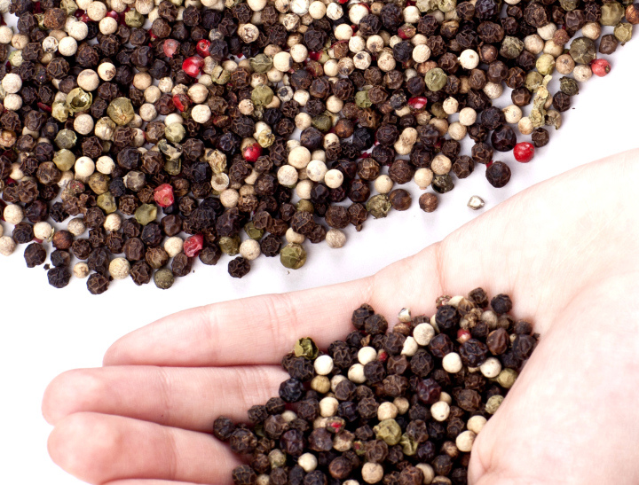 Grains Of Pepper In A Hand