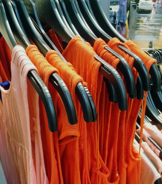 Clothes On Hangers In A Clothing Store