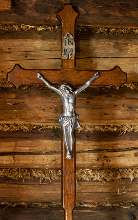 Cross on the wall of the old cottage