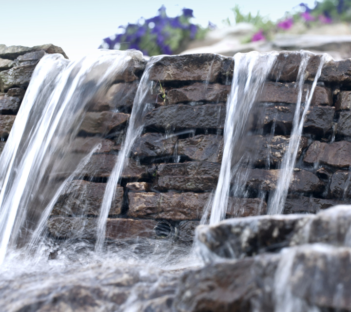 A Small Waterfall In The Garden