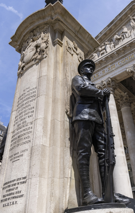 A statue of a soldier with a rifle, in front of the Royal Exchange opposite the Bank of England in the City of London