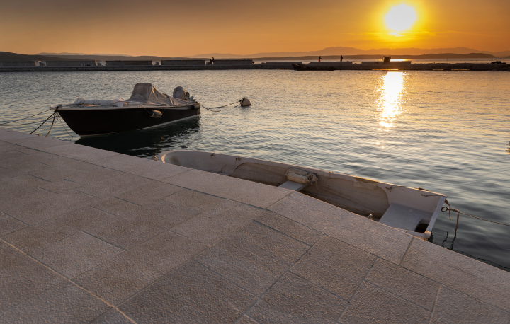 Stone Wharf and moored motorboat, Croatia