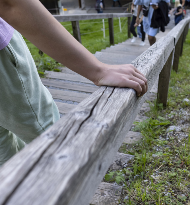 Hand on a Wooden Handrail