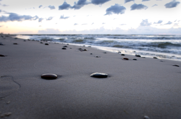 Several Stones On A Sandy Beach