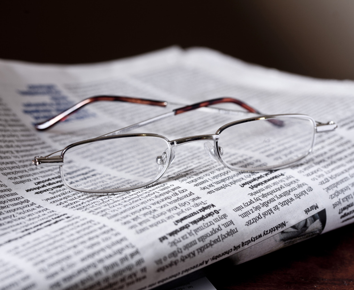 Glasses On The Newspaper