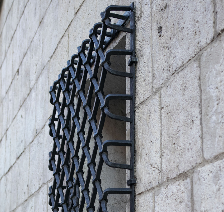 Wrought Steel Grille in the Window of a Historic Building